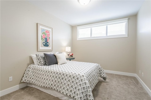 carpeted bedroom with baseboards