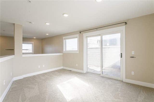 carpeted empty room with recessed lighting and baseboards