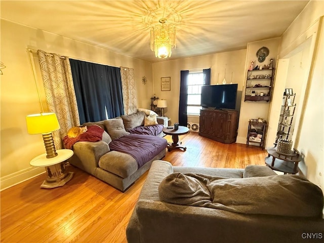 living area with wood finished floors and baseboards