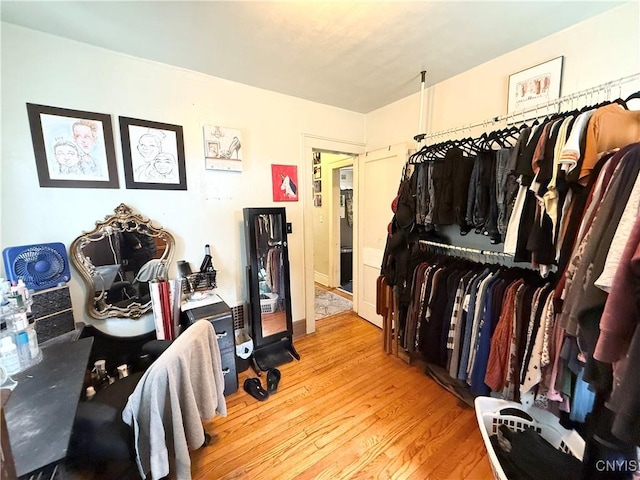 walk in closet featuring wood finished floors