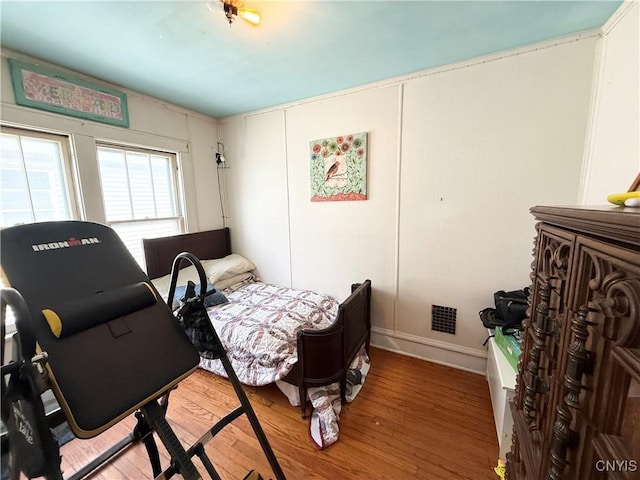 bedroom with wood finished floors