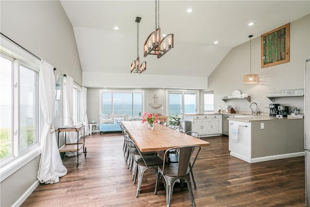 dining room featuring dark wood-style floors, baseboards, high vaulted ceiling, recessed lighting, and a chandelier