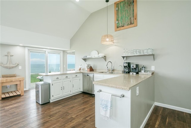 kitchen with open shelves, dark wood-type flooring, stainless steel dishwasher, and a peninsula