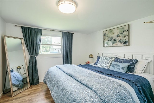 bedroom featuring wood finished floors