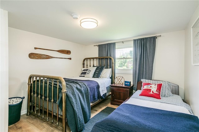 bedroom featuring wood finished floors