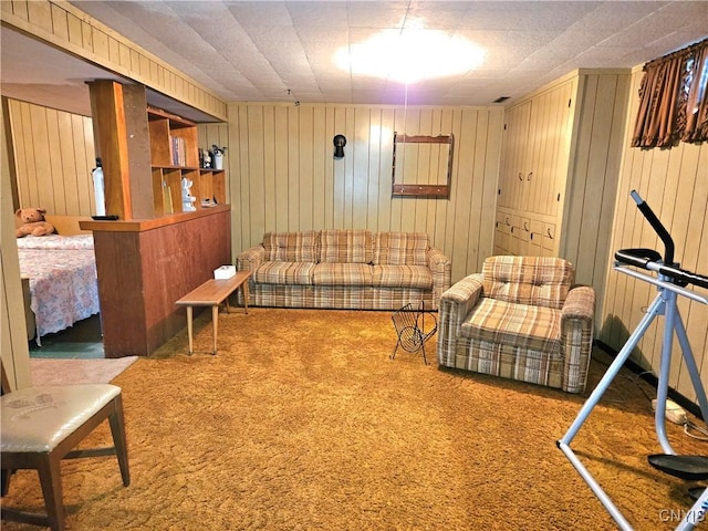 living room with wooden walls and carpet