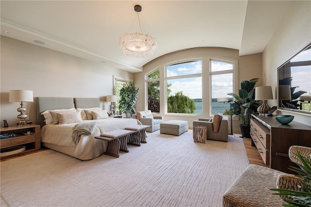 bedroom with a chandelier, multiple windows, and lofted ceiling