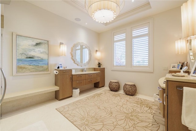 full bath with a tray ceiling, baseboards, vanity, and tile patterned flooring