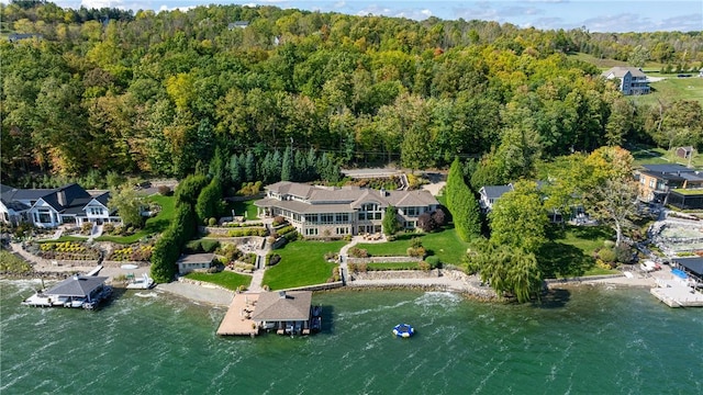 aerial view featuring a view of trees and a water view