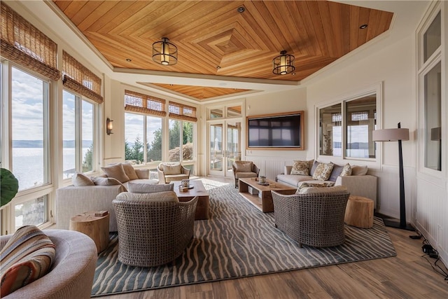 sunroom with wood ceiling and a tray ceiling