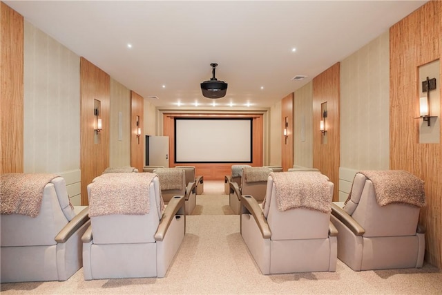 cinema featuring recessed lighting, carpet, and wood walls