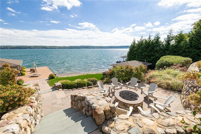 water view featuring an outdoor fire pit