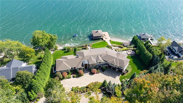 birds eye view of property featuring a water view and a residential view