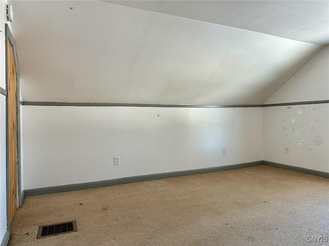 bonus room featuring baseboards, visible vents, carpet floors, and lofted ceiling