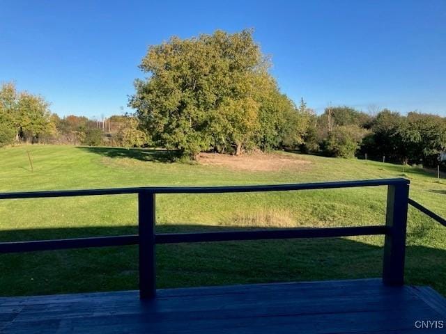 exterior space featuring a lawn and fence