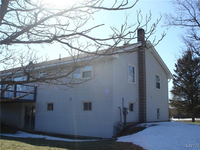 view of side of property featuring a chimney