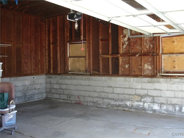 garage featuring concrete block wall