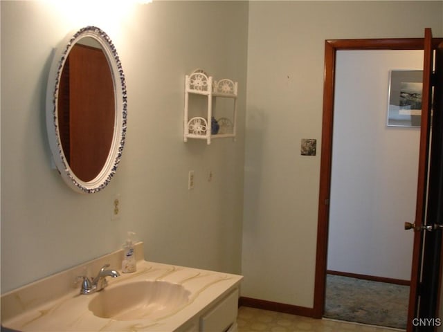 bathroom with baseboards and vanity