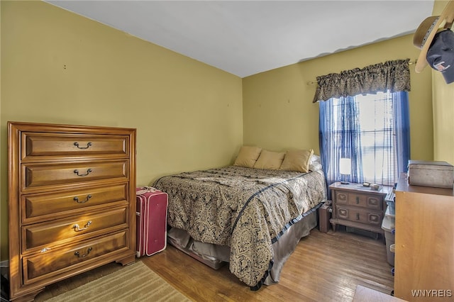 bedroom featuring wood finished floors