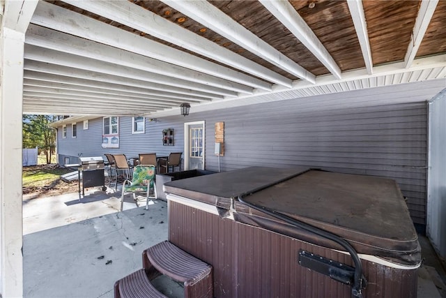 view of patio with a hot tub