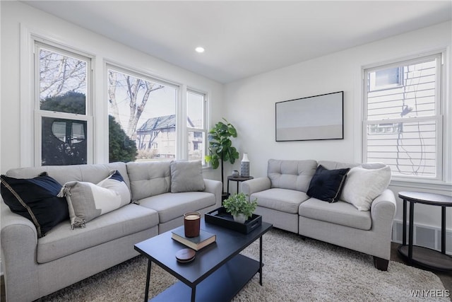 living area featuring recessed lighting and visible vents