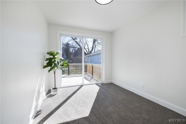 interior space with baseboards and carpet floors