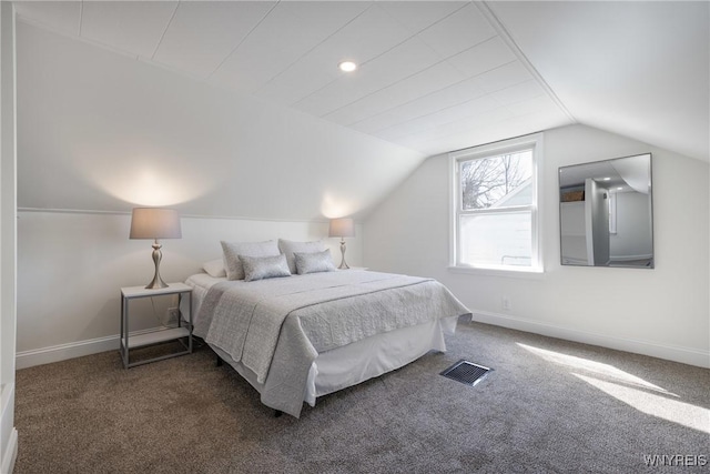 bedroom with vaulted ceiling, carpet, and baseboards