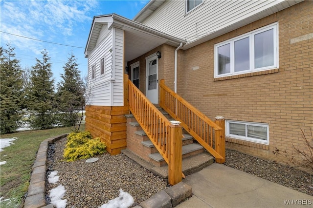 entrance to property with brick siding