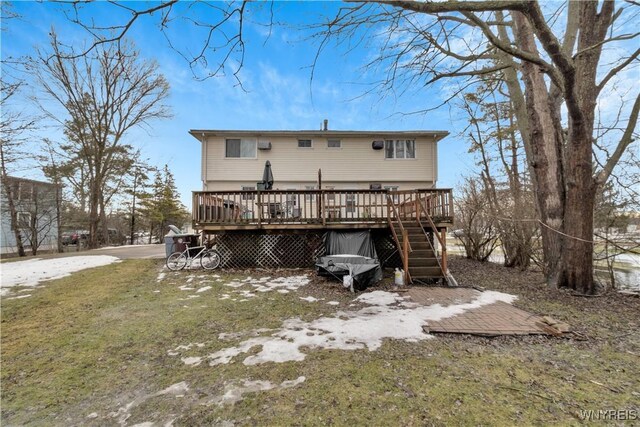 rear view of house with a deck and stairway