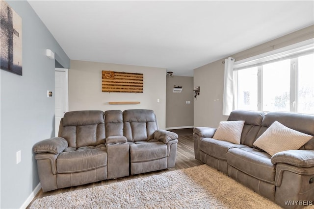 living room with wood finished floors and baseboards