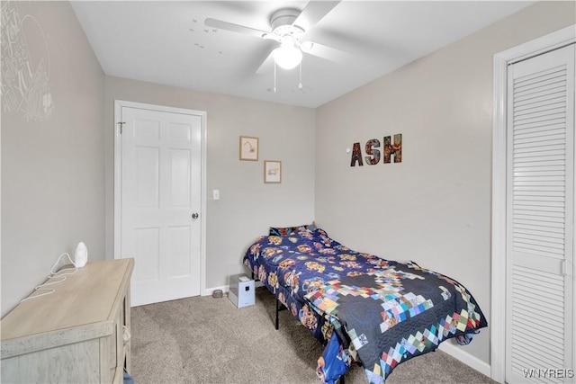 carpeted bedroom with baseboards and ceiling fan