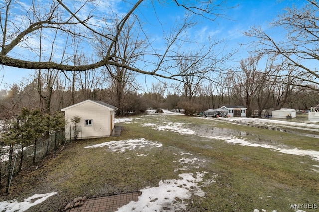 view of yard with an outbuilding and a shed