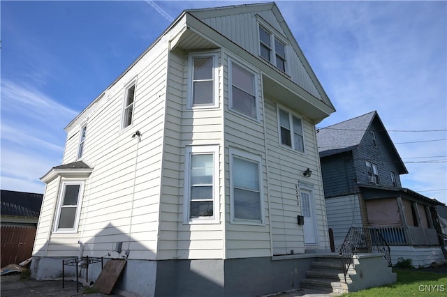 view of property exterior with fence