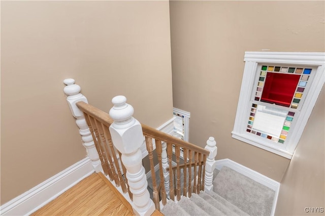 stairway featuring baseboards