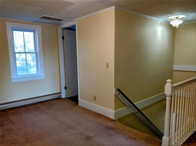 spare room with visible vents, carpet floors, crown molding, a baseboard radiator, and baseboards