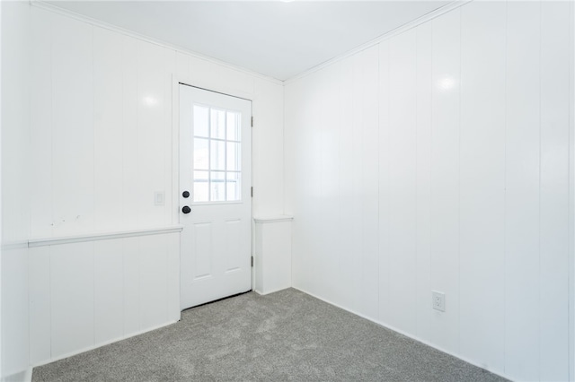 carpeted empty room with ornamental molding