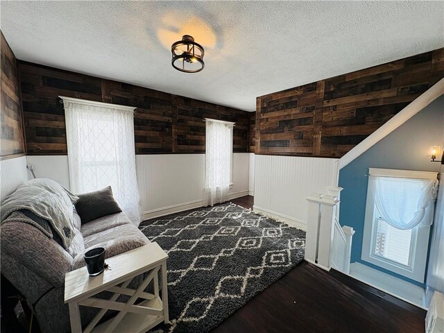 living room with dark wood finished floors and a textured ceiling