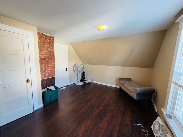 bonus room featuring baseboards, dark wood finished floors, and vaulted ceiling