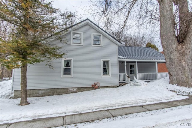 view of front of home with metal roof and a porch