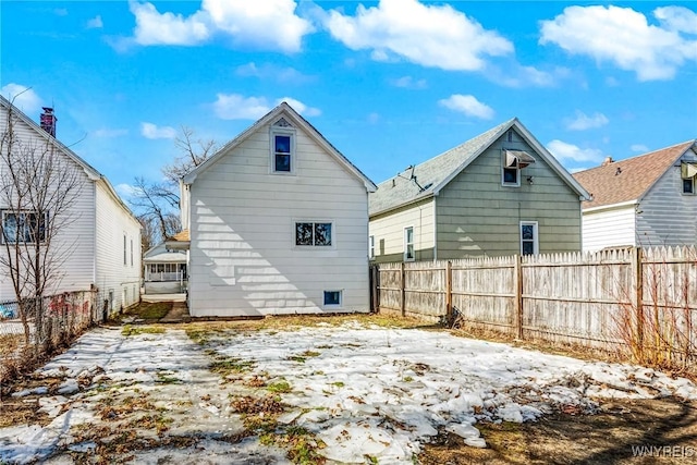 back of property featuring fence