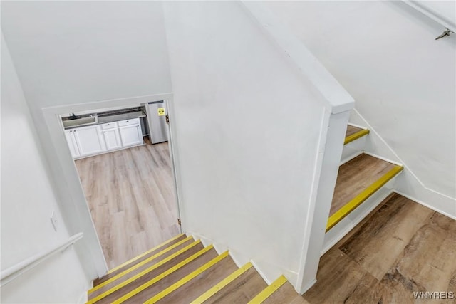 stairs with wood finished floors