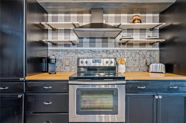 kitchen with wooden counters, electric stove, wall chimney range hood, and open shelves