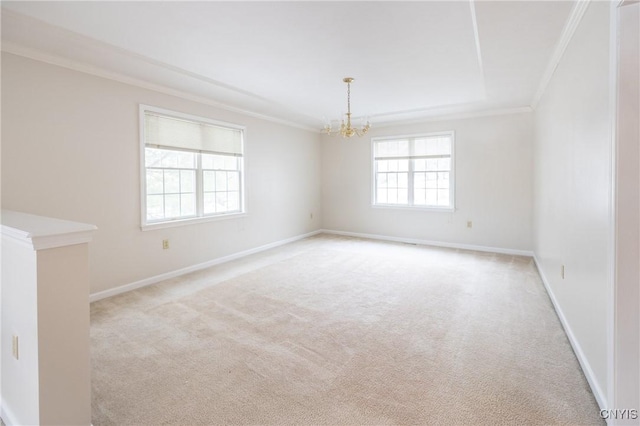 unfurnished room featuring a notable chandelier, ornamental molding, baseboards, and light carpet