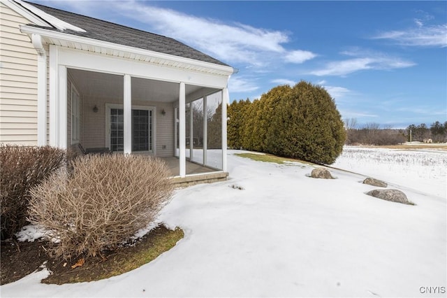 view of yard layered in snow