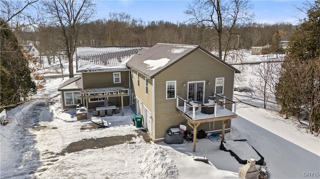 view of snow covered house