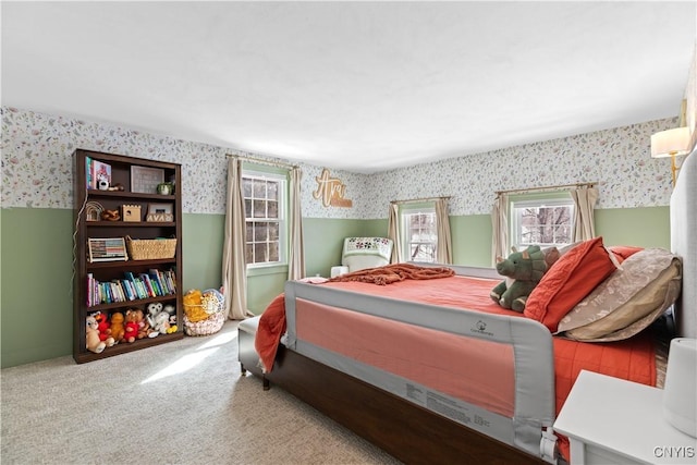 carpeted bedroom featuring wallpapered walls