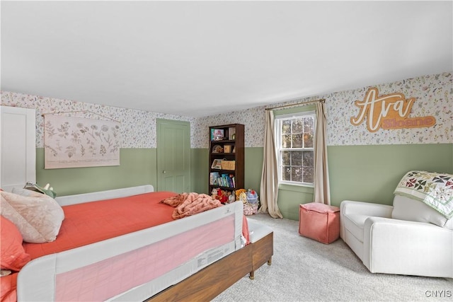 bedroom with carpet flooring and wallpapered walls