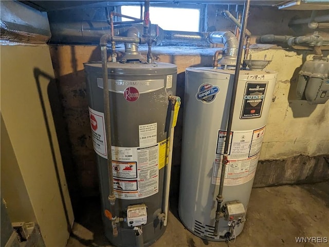 utility room featuring gas water heater