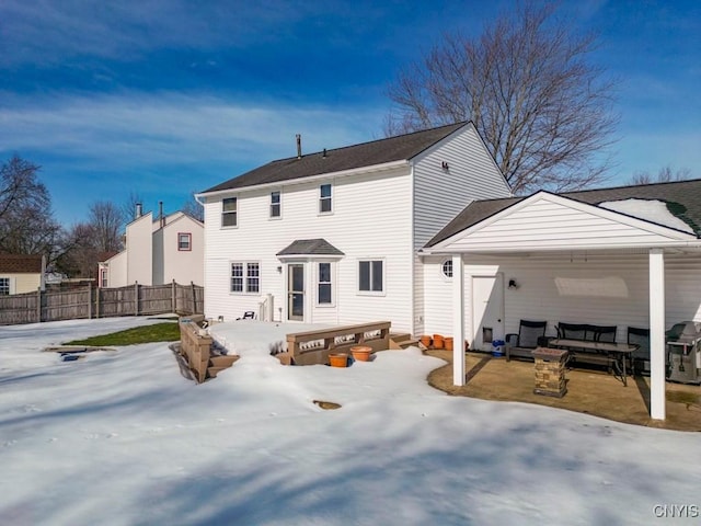 back of property with a patio and fence