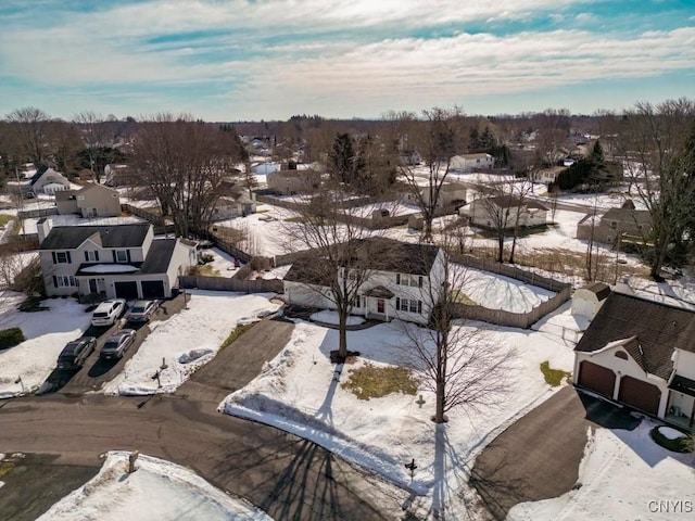 snowy aerial view featuring a residential view